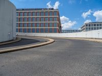 a car is driving on the highway through an underground parking garage area in a city