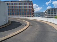 a car is driving on the highway through an underground parking garage area in a city