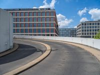 a car is driving on the highway through an underground parking garage area in a city