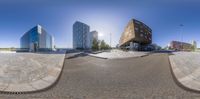 three buildings that are side by side in the city, taken from a fisheye