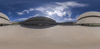 three circular panoramic images of an outdoor court space with a cloudy blue sky