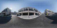 a 360 - view of a parking garage and skate park from a fisheye lens