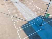 a parking lot is being cleaned and painted to look like the mazed surface of an airport