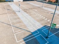 a parking lot is being cleaned and painted to look like the mazed surface of an airport