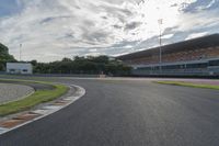 a photo of the asphalt that goes around the corner for racing track markings and markings