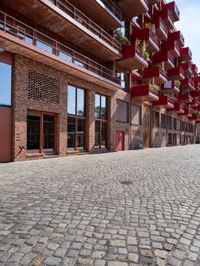 a very brick and red building with a sky background that looks to be an urban park