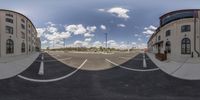 a parking lot is shown with two identical pictures on the same camera lens a sky full of clouds and some buildings with multiple levels