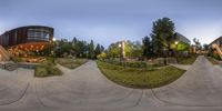 many skateboarders are doing tricks on a nice day and night outdoors on the course