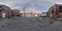 some buildings and cars near one another in the picture fisheye - style 3d picture