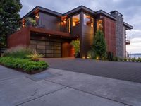 the home has a nicely designed driveway that leads to the house's main entrance