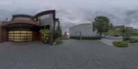 this is an outside shot of a residential house with circular driveway and paved walkways