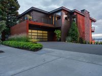 an upscale house in the suburbs of vancouver, canada that was recently renovated and has its own garage, and yard space with a patio