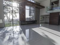 a room with a big window and large white tile flooring area area and two sets of windows with wooden walls