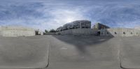 the view of a skate park, as seen from a side angle with no one riding