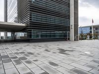 an image of the outside of a building with its entrance open in a courtyard space