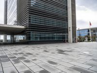 an image of the outside of a building with its entrance open in a courtyard space