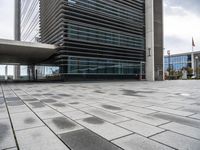 an image of the outside of a building with its entrance open in a courtyard space