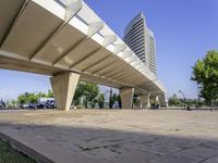 a paved walkway that goes up to a building in the city that has a low rise