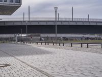 a view of a stone road and bridge overpasses at a sports complex in europe