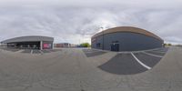 a fisheye lens image of the same location for a sports store on a city street