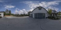 a fish eye lens image of a modern style home for a garage in a neighborhood