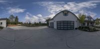 a fish eye lens image of a modern style home for a garage in a neighborhood