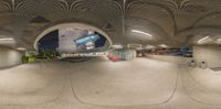 a photo taken through the 360 - 360 lens of a subway station with benches, signs and windows