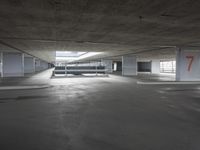 a car park that has the parking lots opened to let it inside of the building