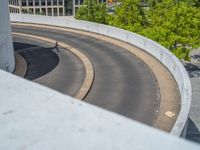 a car is driving on the highway through an underground parking garage area in a city