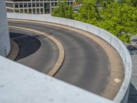 a car is driving on the highway through an underground parking garage area in a city