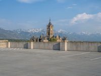 several large empty parking spaces in the city with buildings nearby in front of them -