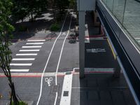 a parking space with bikes on it and pedestrian crossing for pedestrians to ride up and down the street