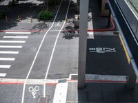 a parking space with bikes on it and pedestrian crossing for pedestrians to ride up and down the street