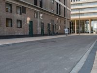 a street scene with a very long building and no cars on it's way