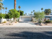 a small palm tree is in the front yard of a house that's on sale for $ 655, 000