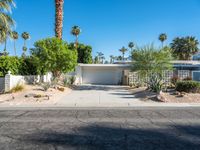 a small palm tree is in the front yard of a house that's on sale for $ 655, 000