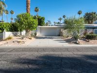 a small palm tree is in the front yard of a house that's on sale for $ 655, 000