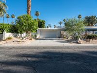 a small palm tree is in the front yard of a house that's on sale for $ 655, 000