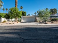 a small palm tree is in the front yard of a house that's on sale for $ 655, 000