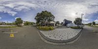 360 - camera shot of a home with gravel parking space and street in the foreground