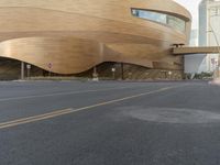 the large wooden building has been painted a light brown color to resemble a wave of wood