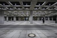 Monochrome Architectural Hall: Black Floor with Symmetrical Style