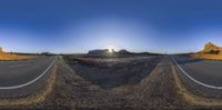 an image of a very long straight road in the desert with a mountain in the background