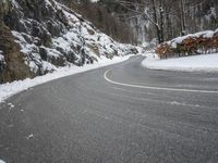 Moody Landscape: Grey Sky and Snow Covered Road
