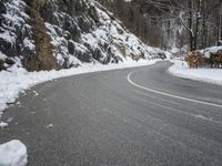 Moody Landscape: Grey Sky and Snow Covered Road