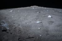 a view from a moon crater shows small pieces of dirt, ice and trash all around