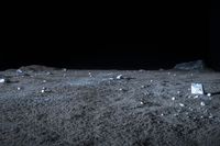 a view of rock and boulders on a dark moon surface, taken from a low angle