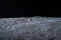 a photo of an object on the moon with other objects and pieces of equipment on the ground