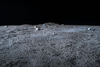 a photo of an object on the moon with other objects and pieces of equipment on the ground