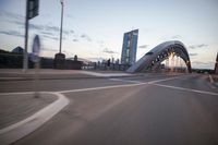 the view of two lanes and the bridge, from behind them on a vehicle's driving